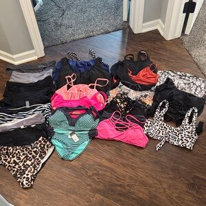 Several swim suit tops and bottoms. Mixed matched.